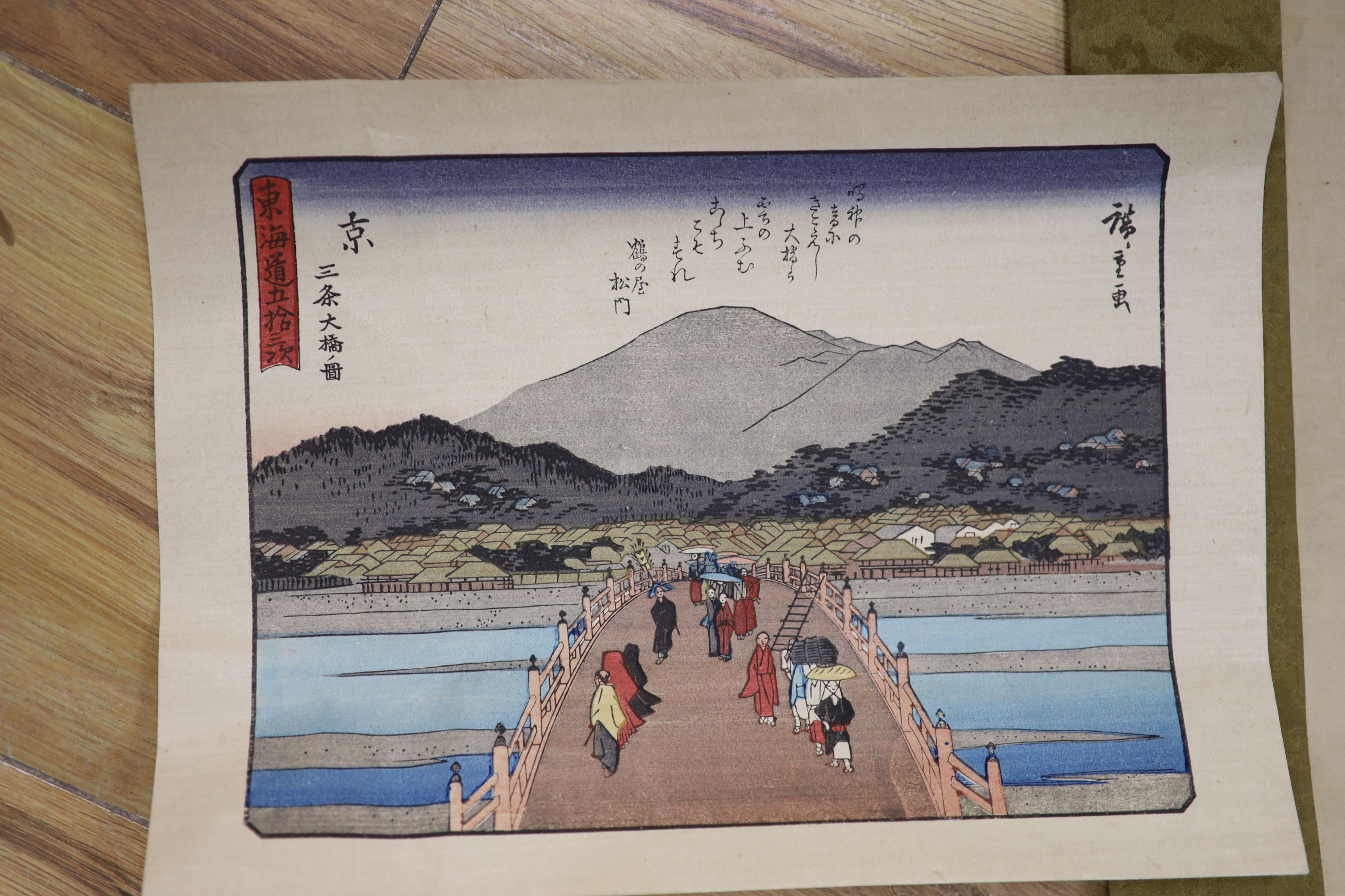 A watercolour on silk scroll painting and three unframed woodblock prints
